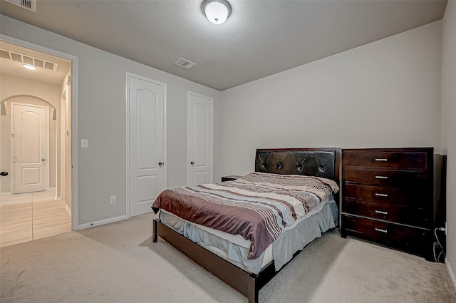 carpeted bedroom featuring a closet