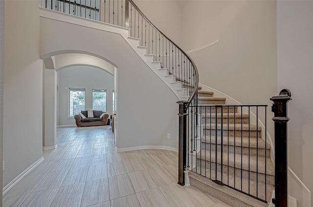 entryway with a towering ceiling