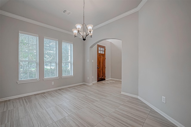 spare room with a chandelier and ornamental molding