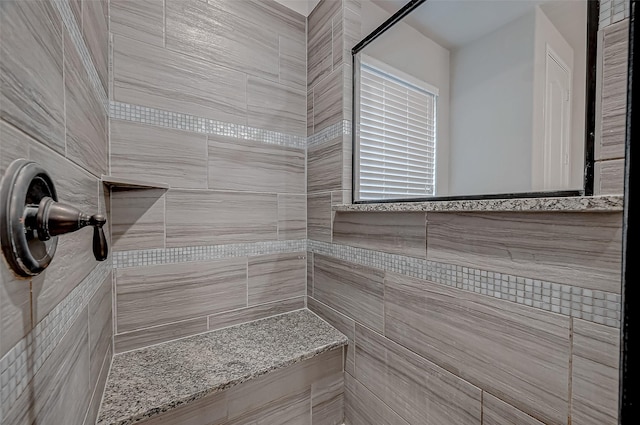 bathroom featuring tiled shower