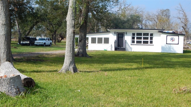 view of front of home with a front yard