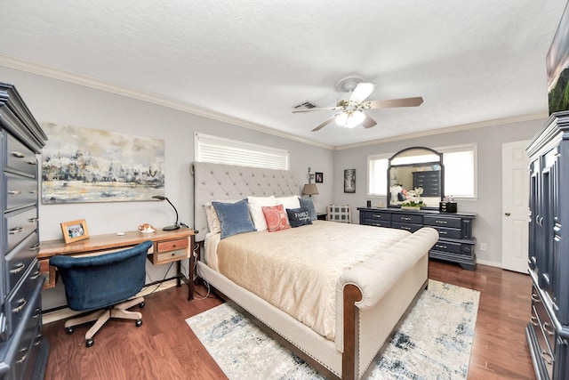 bedroom with visible vents, baseboards, a ceiling fan, dark wood-type flooring, and crown molding