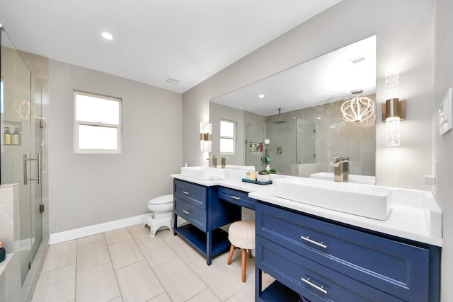 full bathroom with a stall shower, a sink, and double vanity