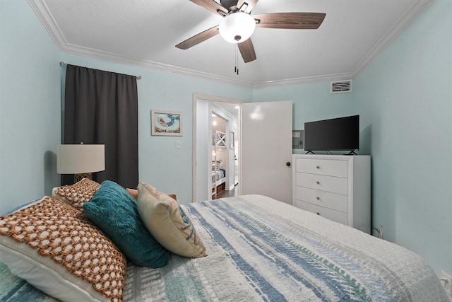 bedroom featuring ceiling fan, visible vents, and ornamental molding