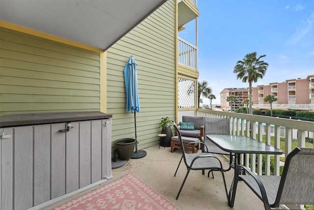 view of patio with a balcony