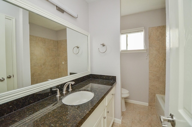 full bath with vanity, baseboards, a bathing tub, walk in shower, and toilet