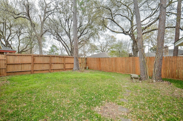 view of yard featuring a fenced backyard