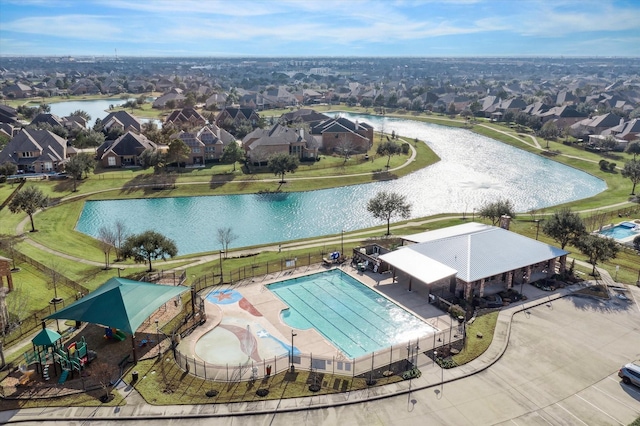 bird's eye view with a residential view and a water view