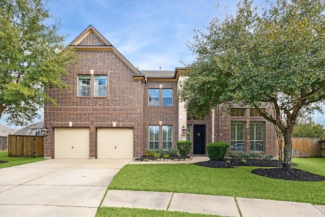 traditional home with driveway, a garage, fence, a front lawn, and brick siding