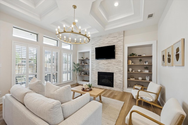 living area with built in shelves, coffered ceiling, a fireplace, and wood finished floors