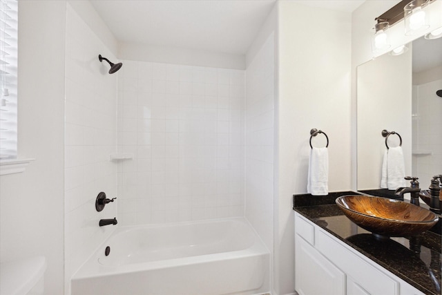 bathroom featuring vanity and washtub / shower combination