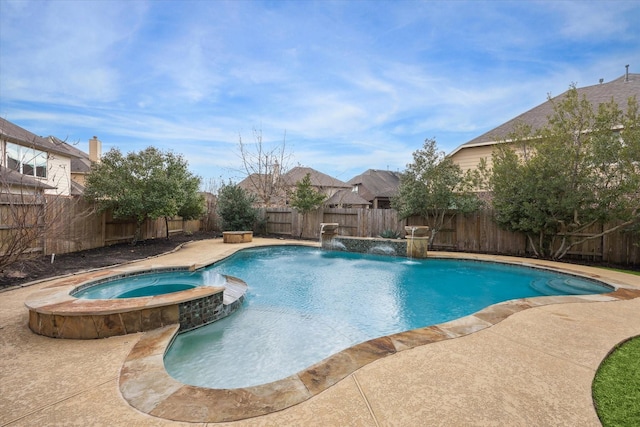 view of pool featuring a patio area, a fenced backyard, and a pool with connected hot tub