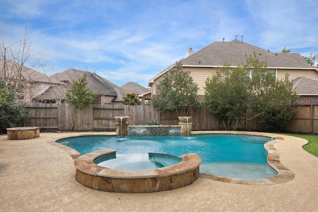 view of swimming pool with a patio area, a fenced backyard, and a pool with connected hot tub