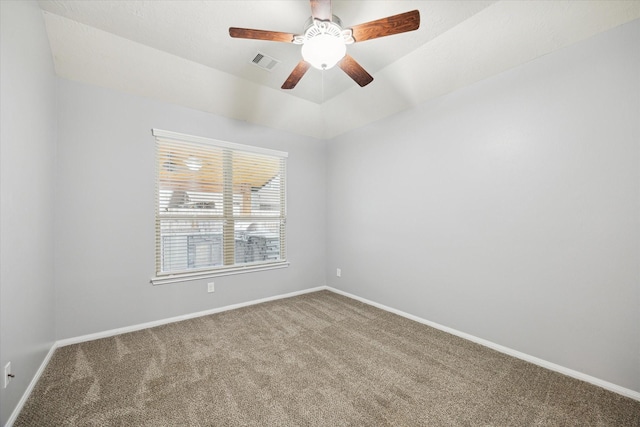 unfurnished room featuring carpet, visible vents, ceiling fan, and baseboards