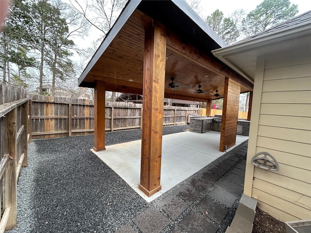 view of patio featuring ceiling fan and a fenced backyard