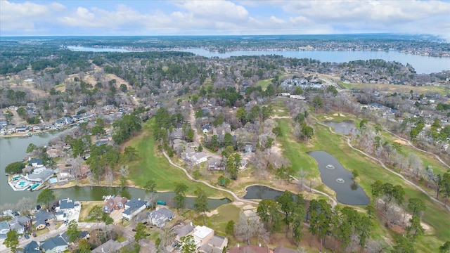 drone / aerial view featuring a residential view and a water view