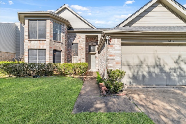 view of front of home featuring a garage, a shingled roof, brick siding, concrete driveway, and a front yard