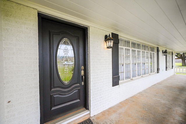 1133 Peebles St, Hempstead, TX 77445 - property entrance with covered porch and brick siding