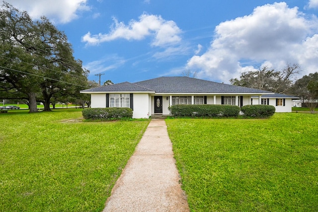 ranch-style house with a front lawn and stucco siding