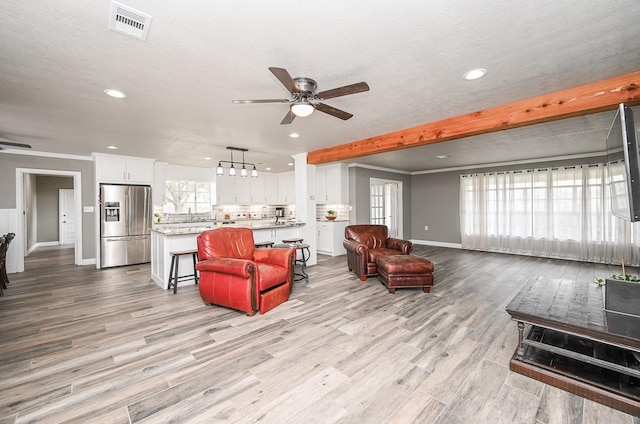 1133 Peebles St, Hempstead, TX 77445 - living area featuring ceiling fan, baseboards, recessed lighting, and light wood finished floors