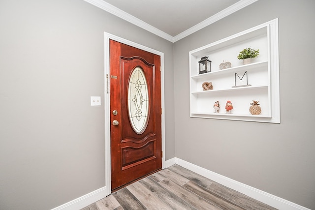 1133 Peebles St, Hempstead, TX 77445 - entrance foyer with wood finished floors, crown molding, and baseboards