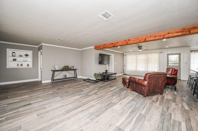 living area with light wood-type flooring, baseboards, visible vents, and ornamental molding