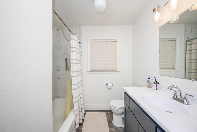 1133 Peebles St, Hempstead, TX 77445 - bathroom with vanity, toilet, wood finished floors, shower / tub combo, and baseboards