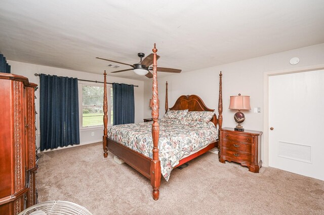 bedroom with light carpet, ceiling fan, and visible vents