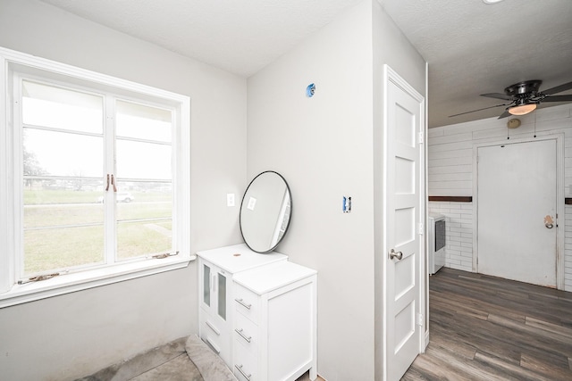 1133 Peebles St, Hempstead, TX 77445 - corridor featuring wood finished floors and a textured ceiling