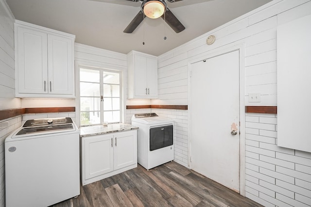 1133 Peebles St, Hempstead, TX 77445 - kitchen with ceiling fan, white cabinetry, dark wood-type flooring, wood walls, and washing machine and clothes dryer