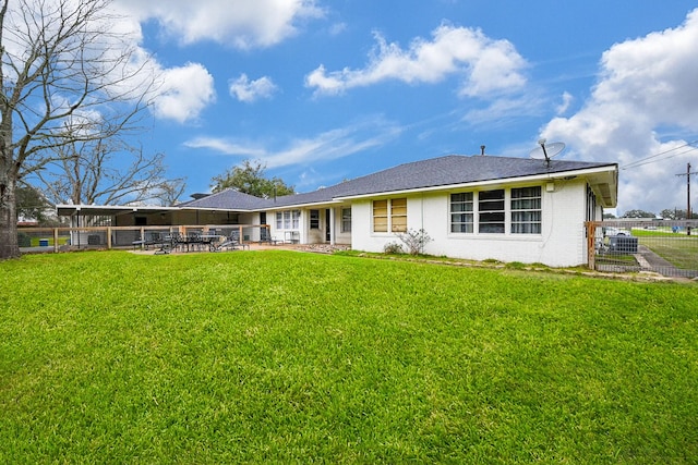 1133 Peebles St, Hempstead, TX 77445 - rear view of property featuring a patio and brick siding