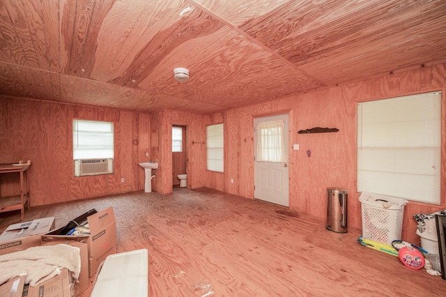 1133 Peebles St, Hempstead, TX 77445 - miscellaneous room featuring wood ceiling, wood finished floors, wooden walls, cooling unit, and a sink