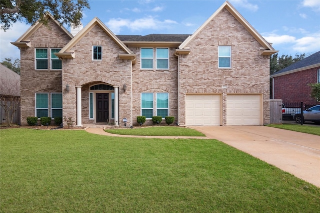 view of front facade featuring a garage and a front yard