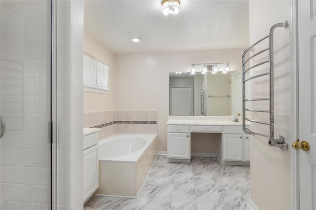 bathroom featuring independent shower and bath and vanity