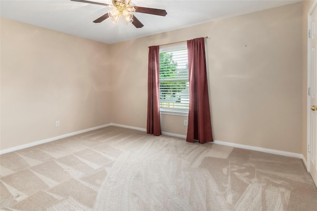 empty room featuring light carpet and ceiling fan