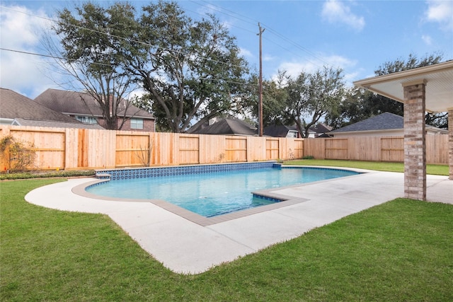 view of swimming pool with a lawn