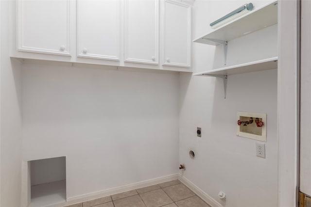 laundry room featuring light tile patterned floors, gas dryer hookup, hookup for a washing machine, cabinets, and electric dryer hookup