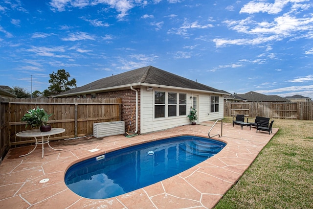 view of swimming pool featuring a patio area and a fenced backyard