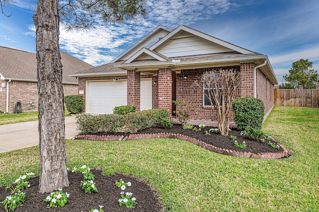 ranch-style house featuring an attached garage, a front yard, and brick siding