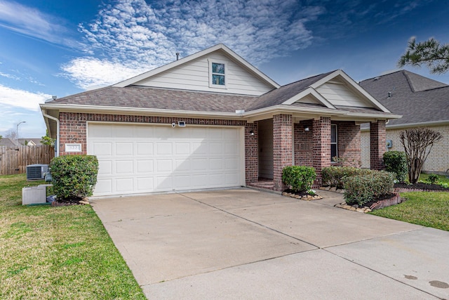 view of front of home featuring a garage, fence, concrete driveway, and brick siding