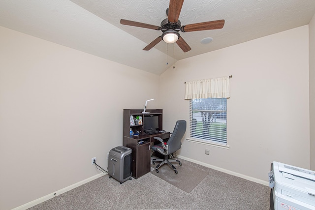 office area featuring carpet floors, a ceiling fan, baseboards, and lofted ceiling
