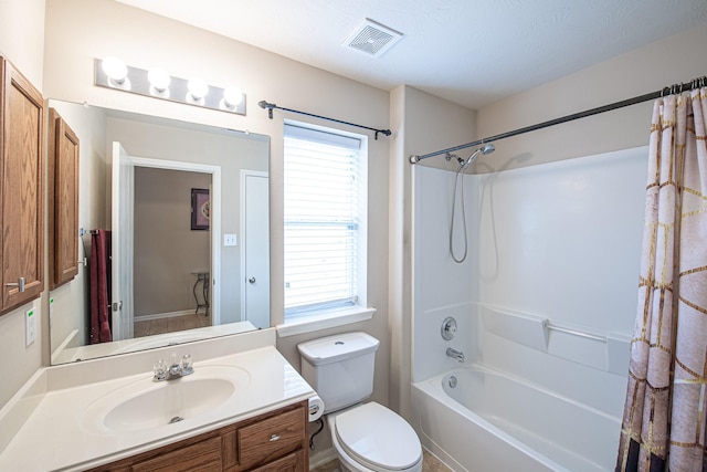 bathroom featuring vanity, toilet, and shower / tub combo