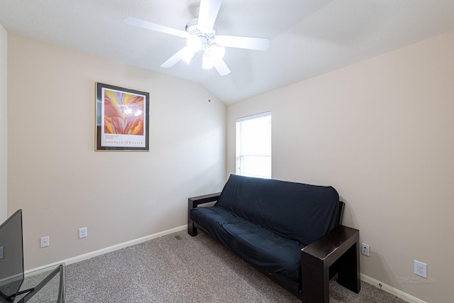 sitting room with carpet, a ceiling fan, baseboards, and vaulted ceiling