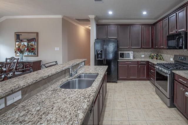 522 Arbor Green Ln, Rosenberg, TX 77469 - kitchen with black appliances, a sink, ornamental molding, decorative backsplash, and light stone counters