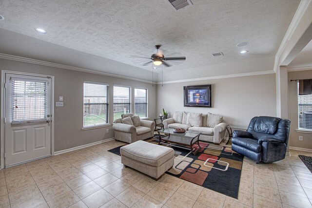 living area with light tile patterned flooring, a ceiling fan, baseboards, crown molding, and a textured ceiling