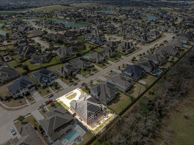 aerial view featuring a residential view and a water view