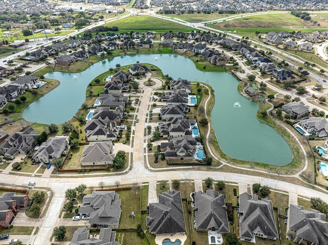 aerial view with a water view and a residential view