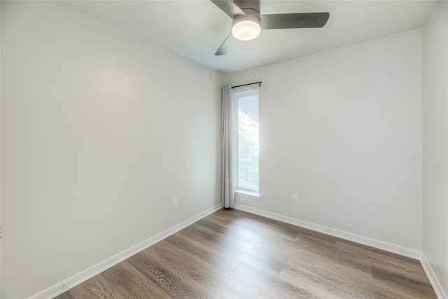 unfurnished room with ceiling fan and wood-type flooring