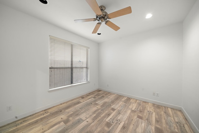 spare room with light wood-style floors, recessed lighting, baseboards, and a ceiling fan