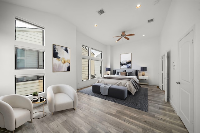 bedroom featuring wood finished floors, visible vents, and recessed lighting